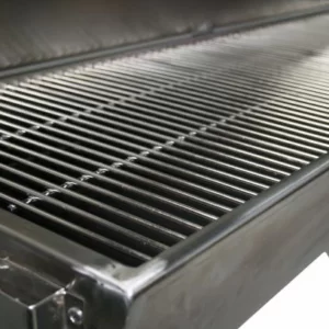 A close up image of the left side of a shiny and clean silver charcoal barbecue.