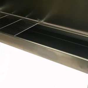 A close up image of the inside of a shiny silver charcoal barbecue